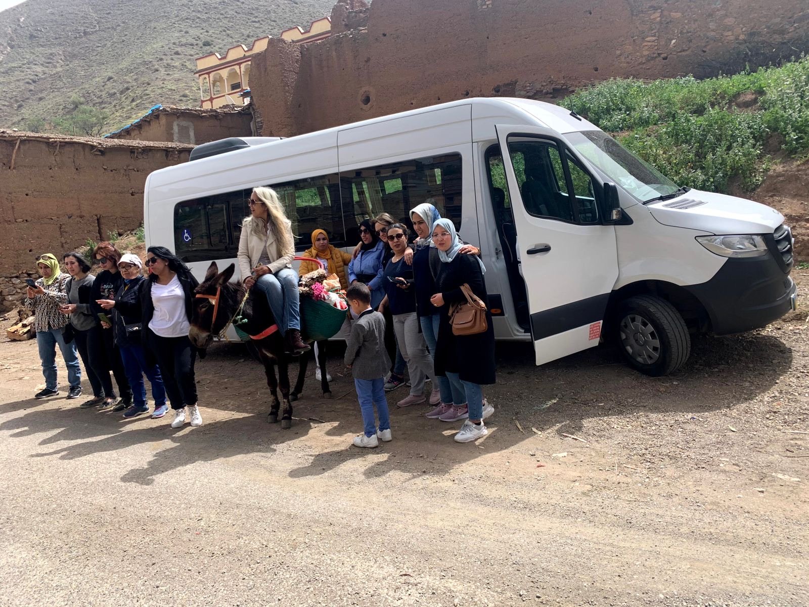 Group with a Mercedes Sprinter minibus in an Atlas Mountains village